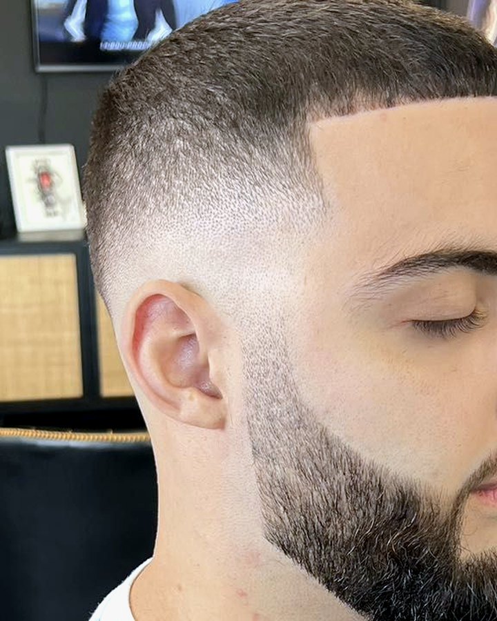 A fade and sculpted beard cut by Ike